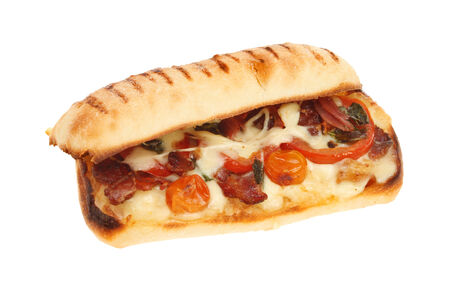 Toasted tomato,panchetta,mozzarella and basil pannini isolated against whiteの写真素材