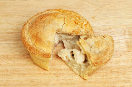 Chicken pie on a wooden boardの写真素材