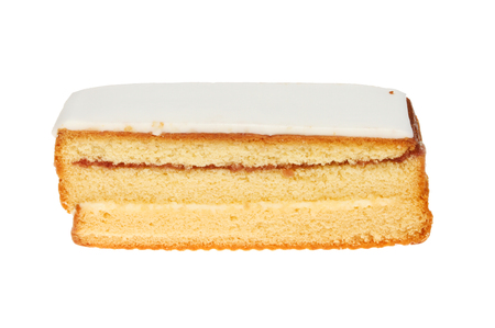 Whole iced Madeira cake isolated against whiteの写真素材