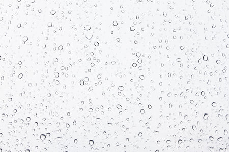 Rain drops on glass as a background and texture