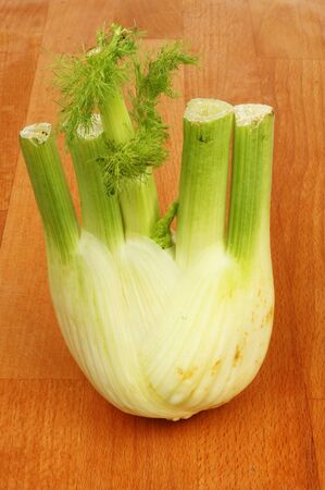 Fennel bulb on a wooden chopping boardの写真素材