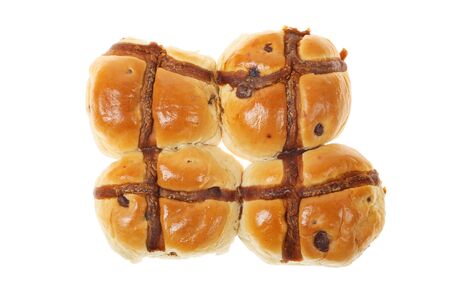 Caramel and chocolate cross buns isolated against whiteの写真素材