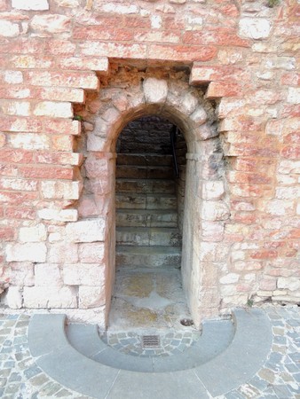 Ancient small door in Spello, Umbria (Italy)の写真素材