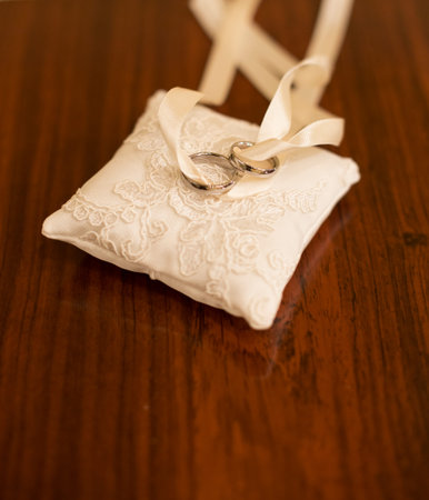 Gold wedding rings on the pincushionの写真素材