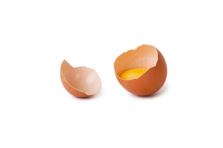 broken raw egg isolated on white background