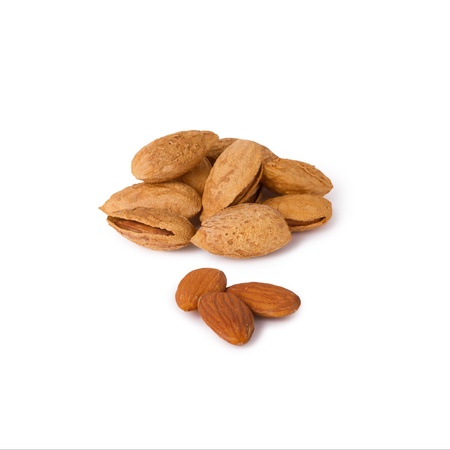 A few raw almonds isolated on white backgroundの写真素材