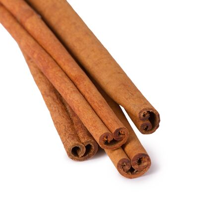 Several cinnamon sticks isolated on white backgroundの写真素材