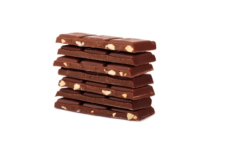 Pile of Chocolate chunks isolated against a white backgroundの写真素材