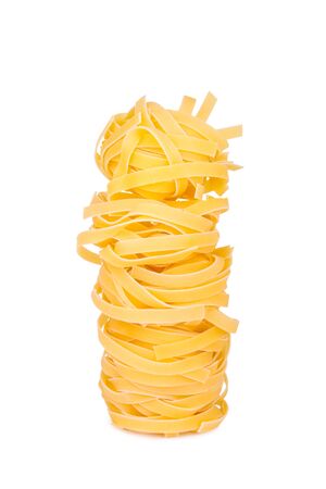 Italian pasta  tagliatelle, isolated on white backgroundの写真素材