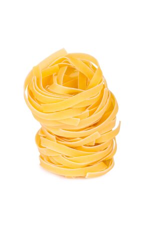 Italian pasta  tagliatelle, isolated on white backgroundの写真素材