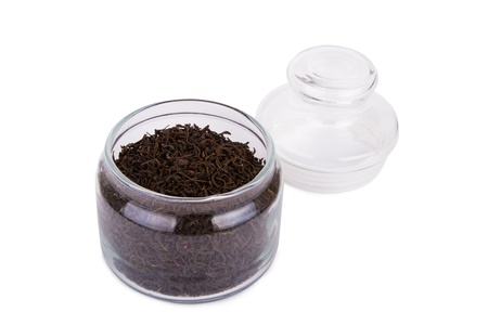Dry black tea leaves isolated on whiteの写真素材