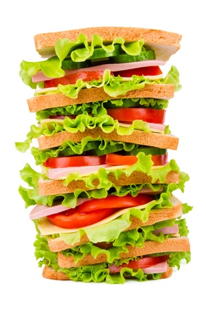 Sandwich with ham,cheese and fresh vegetables isolated on white backgroundの写真素材