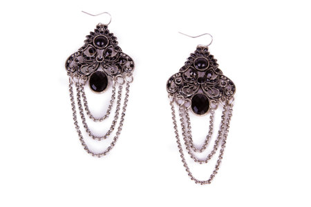 Pair of earrings isolated on the white backgroundの写真素材