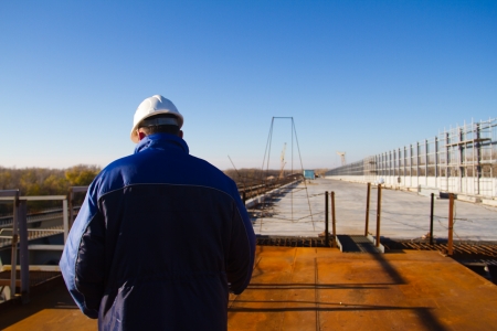 Construction inspection. Construction of a bridge across the riverの写真素材