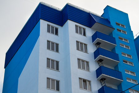 New apartment buildings with blue balconies on a background of blue skyのeditorial素材