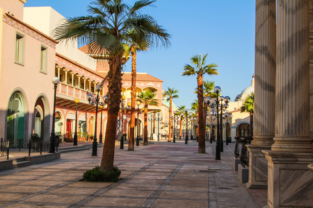 Luxury hotel tourist resort with restaurants, large swimming pool, pool bar, sun loungers, palm trees.の写真素材