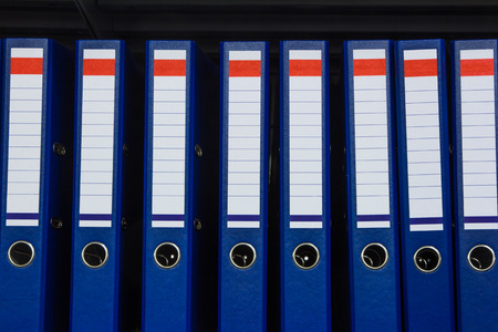 Blue archive folders on the shelf in the storeの写真素材