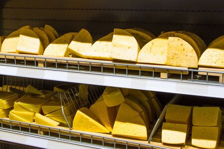 Cheese on a shelf in grocery storeの写真素材