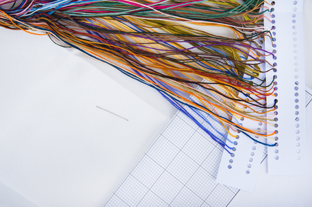 Embroidery set. White linen fabric, colorful threads and needles.の写真素材