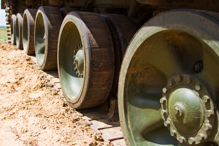 Detail shot with military tank tracks and wheelsの写真素材