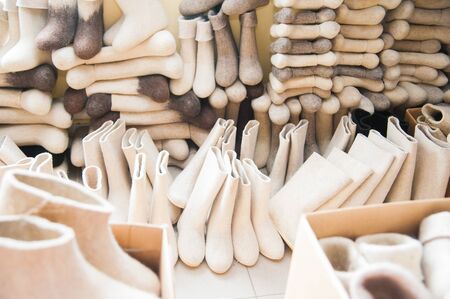 Felt boots on market stand. Valenki are traditional Russian winter footwear.の写真素材