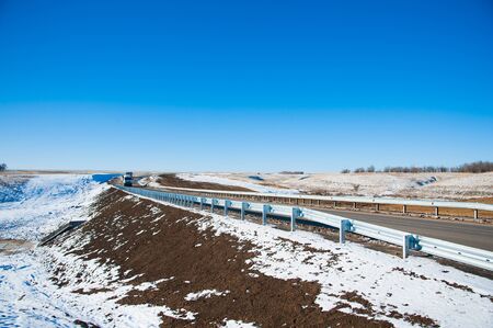 Rural road on a sunny winter dayの写真素材