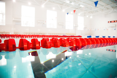 interior of public swimming pool. Lanes of a competition swimming poolの写真素材