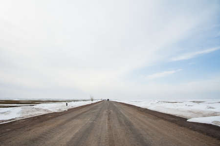 Lonely road in rural area winter dayの写真素材