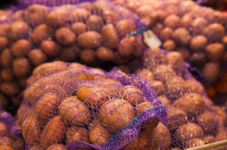 Bunch of fresh new potatoes in supermarketの写真素材