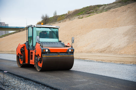 The road rollers working on the new road construction site