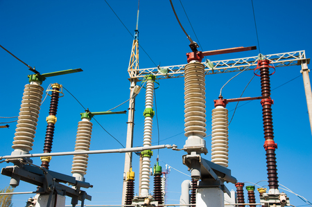 High voltage power transformer substation on blue sky backgroundの写真素材