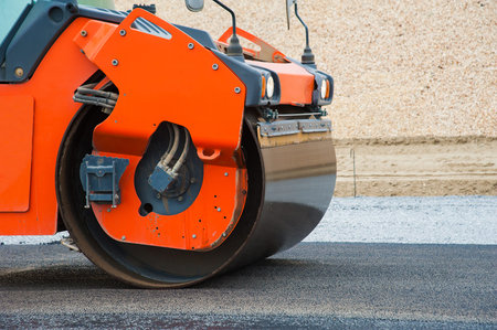 The road rollers working on the new road construction siteの写真素材