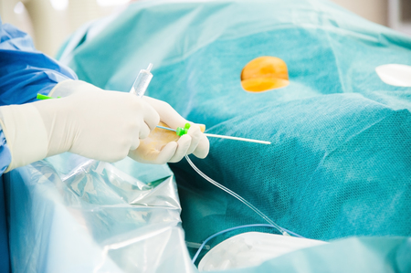 Saving life in hospital operating room. Doctor working in operating roomの写真素材