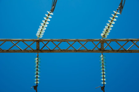High voltage power transformer substation on blue sky background