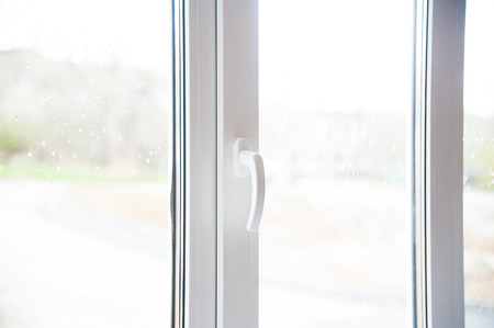 Modern residential window with blue sky behindの写真素材