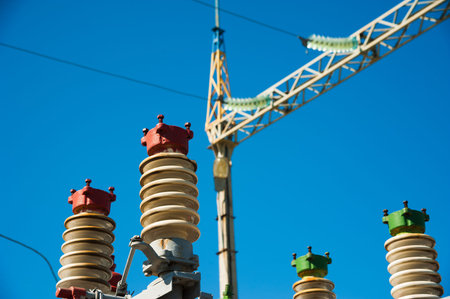 High voltage power transformer substation on blue sky background