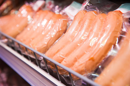 Selection of sausages at a butchers counter or delicatessen windowの写真素材