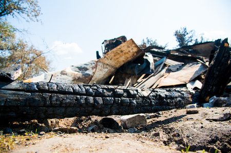 Ruins of house after big disaster - fireの写真素材