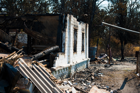 Ruins of house after big disaster - fireの写真素材