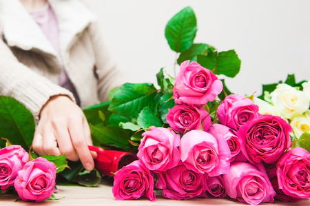 Baskets of colourful roses sale in marketの写真素材