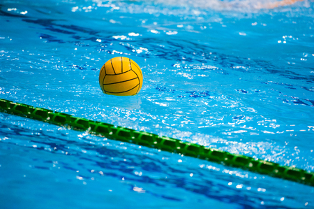 Water polo action in a swimming poolの写真素材