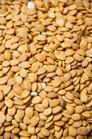 The organic raw fresh whole almonds on display for sale at local confectionery supply storeの写真素材