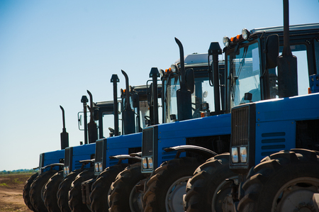 Tractor plowing fields - preparing land for sowingの写真素材