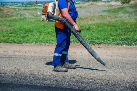 Workers on a road construction, industry and teamwork, new asphalt