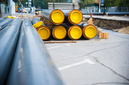 Street reconstruction site of district heating system pipeline and replacement of old pipes with new...