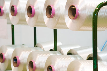 Industrial fabric production line. Weaving looms at a textile factory