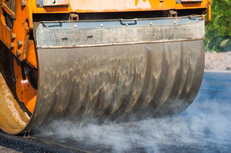 The road rollers working on the new road construction site