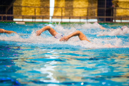 Water polo action in a swimming pool