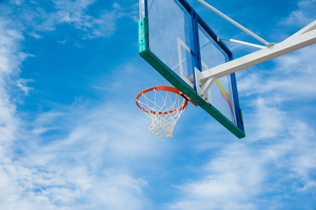 Basketball board over the sky. Outdoor basketball courtの写真素材