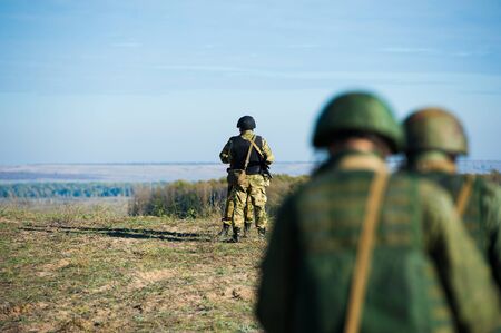 Russian special forces soldiers with weapon take part in military maneuver. War, army, technology and people conceptの写真素材